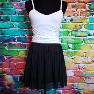 Short black pleated skirt